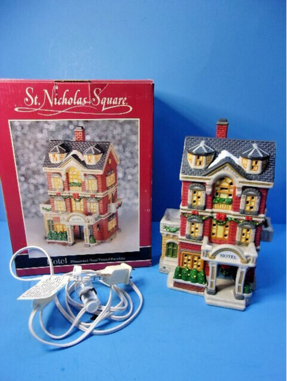 St. Nicholas Square Village Hotel at Christmas Lighted Building Vintage 1997 IOB